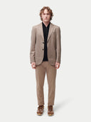 Men's Taupe single-breasted cashmere blazer worn by model front view on backround