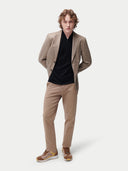 Men's Taupe single-breasted cashmere blazer worn by model front view on backround