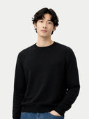 Men's Black Crewneck Cashmere Sweater worn by model, detail view on white background