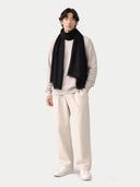 Lightweight Cashmere Woven Scarf Black worn by model, detail view on white background