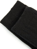 close up of black socks shinbone side