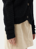 Black cardigan on a light gray background.  #color_garphite_black