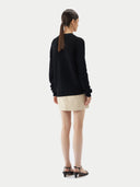 Black cardigan on a light gray background.  #color_garphite_black