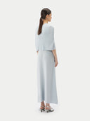 A model is wearing sleeveless cashmere Capelet  #color_ice-flow #color_ice-flow