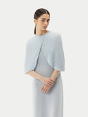A model is wearing sleeveless cashmere Capelet  #color_ice-flow #color_ice-flow