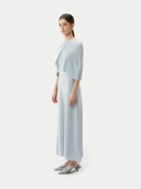 A model is wearing sleeveless cashmere Capelet  #color_ice-flow #color_ice-flow