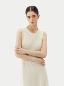 White sleeveless dress on a white background #color_cream-white