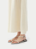 White sleeveless dress on a white background #color_cream-white