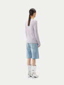 A light lavender ribbed knit long-sleeve top with a crew neck, displayed flat against a light gray background. #color_pale-orchid