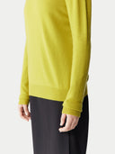 Women's Celery Yellow Cashmere Crewneck Sweater worn by model, detail view on white background