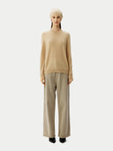 Cashmere € 99 Hat & Sweater Set Beige worn by model, front view on white background