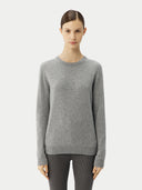 Women's Grey Cashmere Essential Crew Neck Sweater worn by model, detail view on white background