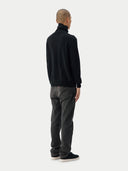 Men's Black Turtleneck Cashmere Sweater worn by model, back view on white background