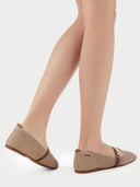 Pair of beige shoes with brown straps on a light gray background #color_nougat-brown