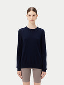 Women's Navy Cashmere Crewneck Sweater worn by model, detail view on white background