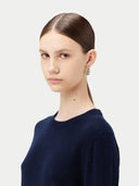 Women's Navy Cashmere Crewneck Sweater worn by model, detail view on white background