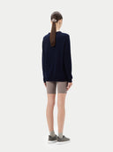 Women's Navy Cashmere Crewneck Sweater worn by model, back view on white background