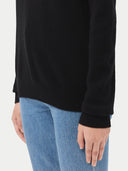 Women's Black Cashmere Crewneck Sweater worn by model, detail view on white background