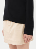 Women's Black Cashmere V-Neck Sweater worn by model, detail view on white background