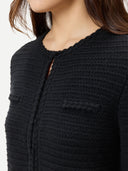 Women's Textured Knit Cashmere Jacket-Style Cardigan Black worn by model, detail view on white background