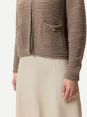 Brown knitted cardigan worn by a person on a white background #color_taupe