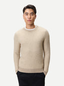 Man wearing a beige cashmere sweater on a white background #color_dusty-beige