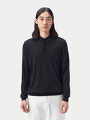 Black long-sleeve cashmere polo shirt on a light gray background. #color_black
