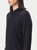 Black long-sleeve cashmere polo shirt on a light gray background. #color_black