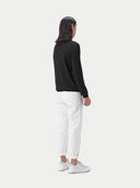 Black long-sleeve cashmere polo shirt on a light gray background. #color_black