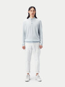 A light blue long-sleeve cashmere polo shirt with a three-button placket, displayed flat against a light gray background. #color_soft-ice