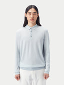A light blue long-sleeve cashmere polo shirt with a three-button placket, displayed flat against a light gray background. #color_soft-ice