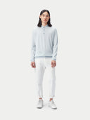 A light blue long-sleeve cashmere polo shirt with a three-button placket, displayed flat against a light gray background. #color_soft-ice