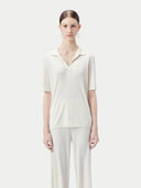 Women's Silk Cashmere Polo Shirt Whisper White worn by model, detail view on white background
