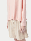 Pink long-sleeve sweater on a light gray background #color_soft-primrose