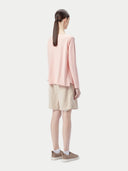 Pink long-sleeve sweater on a light gray background #color_soft-primrose
