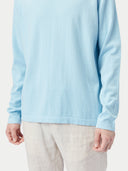 A light blue long-sleeve crewneck sweater displayed flat against a light gray background. #color_forget-blue
