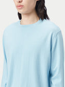 A light blue long-sleeve crewneck sweater displayed flat against a light gray background. #color_forget-blue