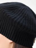 Textured Knit Beret Black worn by model detail view on white background #color_black