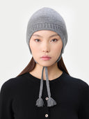 Ultimate Warmth Knit Tie Hat Dim Gray  worn by model, detail view on white background