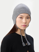 Ultimate Warmth Knit Tie Hat Dim Gray  worn by model, side view on white background
