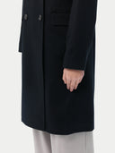 Black cashmere coat on a light gray background #color_black