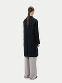 Black cashmere coat on a light gray background #color_black