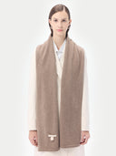Unisex Organic Cashmere Jersey Knit Scarf Taupe worn by model, detail view on white background