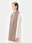 Unisex Organic Cashmere Jersey Knit Scarf Taupe worn by model, detail view on white background