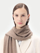Unisex Organic Cashmere Jersey Knit Scarf Taupe worn by model, detail view on white background