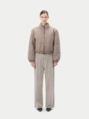 Beige puffer cashmere jacket on a light gray background #color_taupe