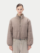 Beige puffer cashmere jacket on a light gray background #color_taupe