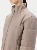 Beige puffer cashmere jacket on a light gray background #color_taupe