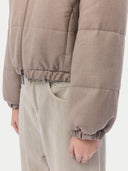 Beige puffer cashmere jacket on a light gray background #color_taupe