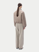 Beige puffer cashmere jacket on a light gray background #color_taupe